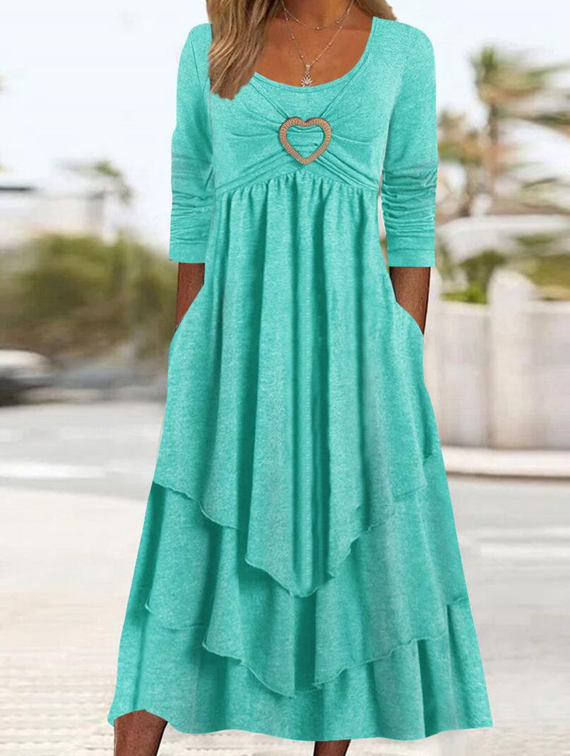 2023. Elegantna jednobojna midi haljina s okruglim izrezom u obliku krpica